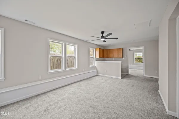 a view of a livingroom with a kitchen