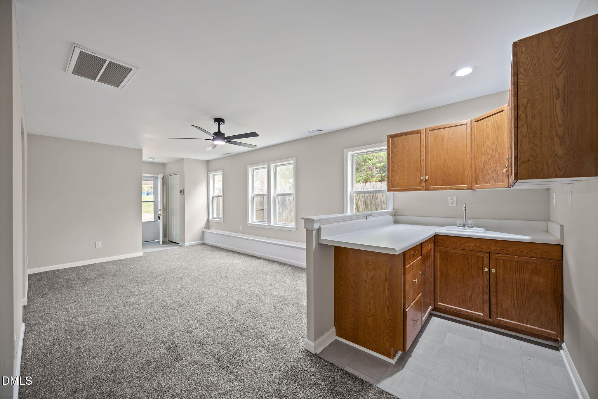 637 Buck Jones Road Raleigh, NC 27606 - Photo 23 of 32 a kitchen with a stove a sink and a refrigerator