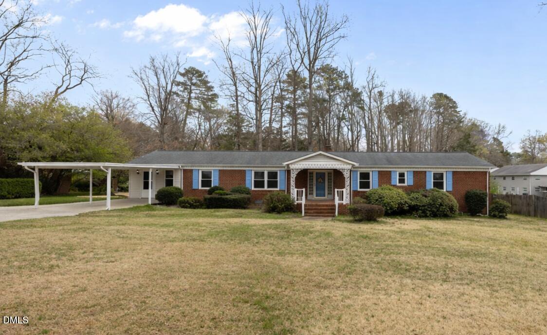 637 Buck Jones Road Raleigh, NC 27606 - Photo 29 of 32 a front view of a house with a yard