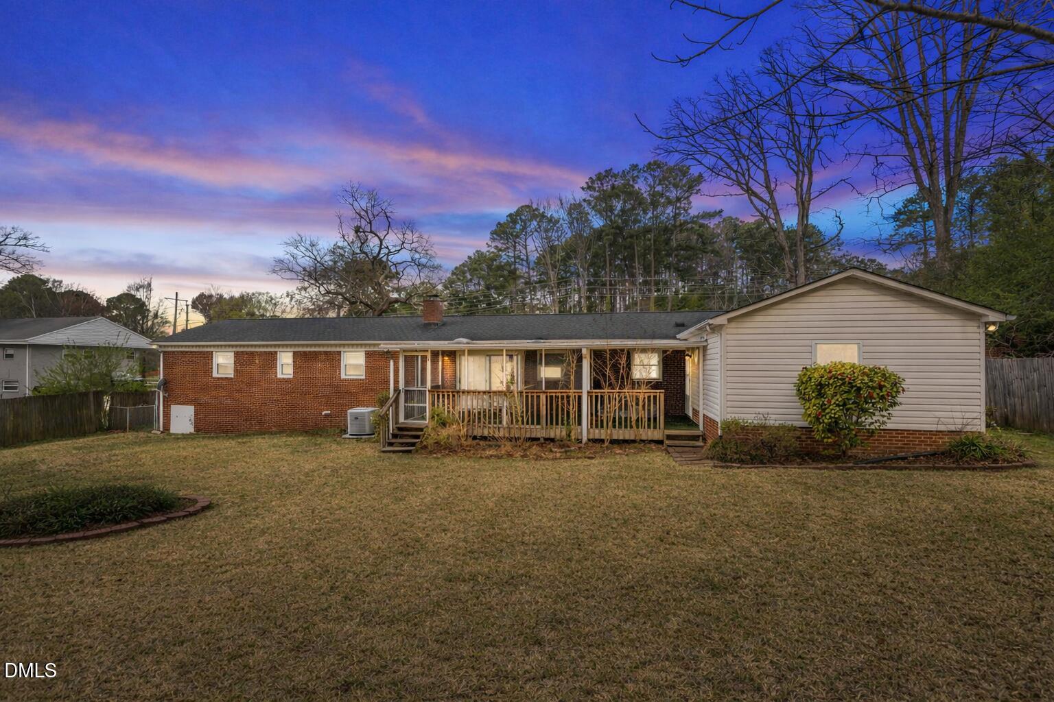 637 Buck Jones Road Raleigh, NC 27606 - Photo 2 of 32 a front view of a house with a yard