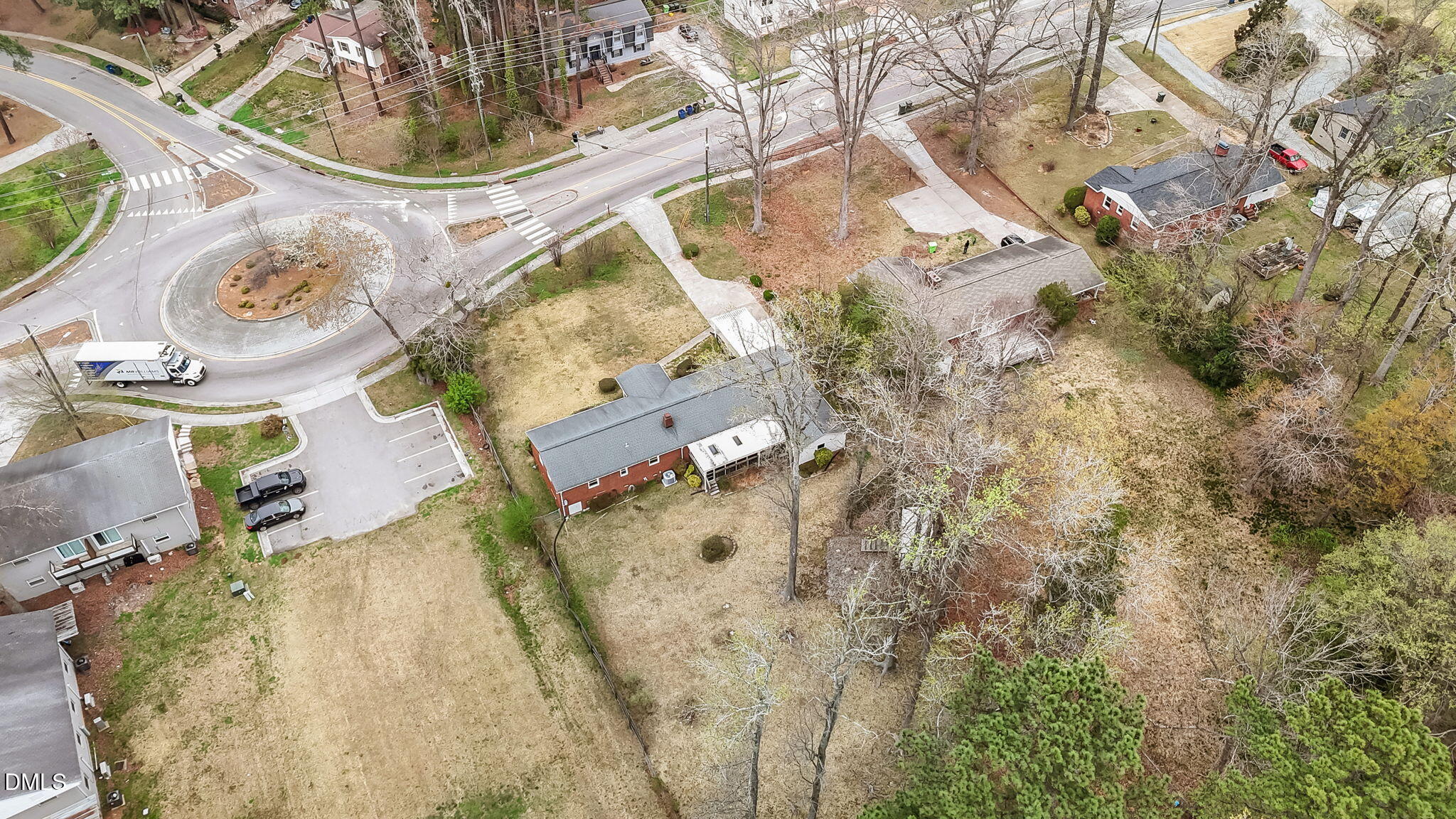 637 Buck Jones Road Raleigh, NC 27606 - Photo 31 of 32 an aerial view of a house with backyard space and a house