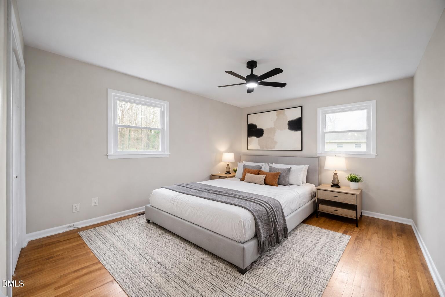 637 Buck Jones Road Raleigh, NC 27606 - Photo 8 of 32 a bedroom with a large bed and a window