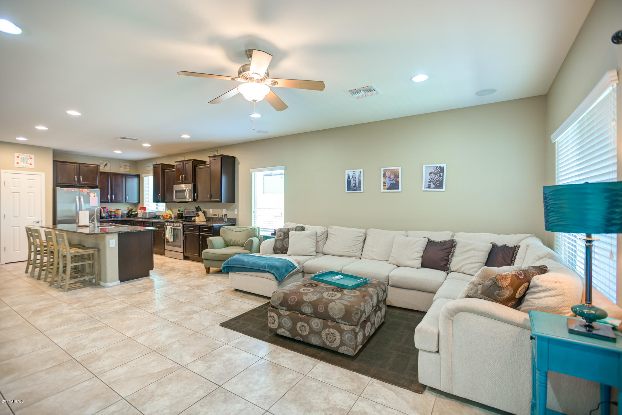 3515 East Ivanhoe Street Gilbert, AZ 85295 - Photo 12 of 49 a living room with furniture kitchen view and a large window