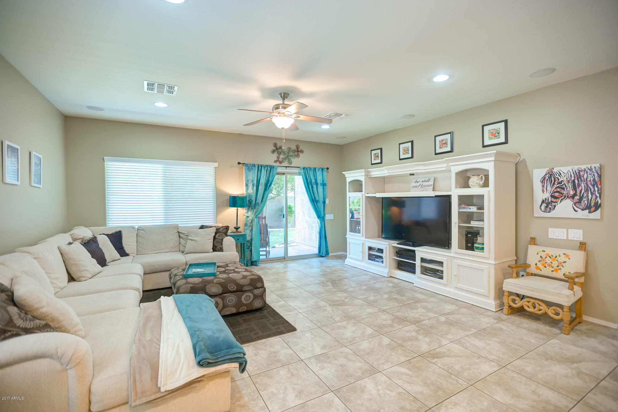3515 East Ivanhoe Street Gilbert, AZ 85295 - Photo 14 of 49 a living room with furniture and a flat screen tv