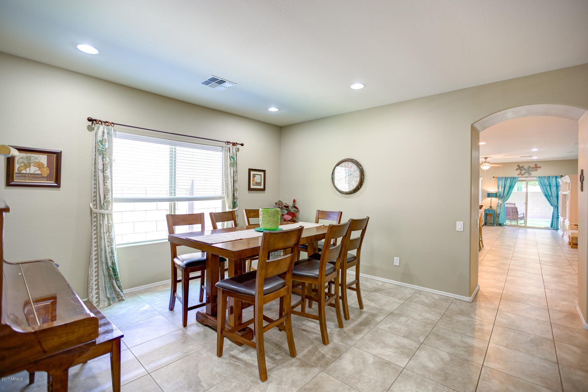 3515 East Ivanhoe Street Gilbert, AZ 85295 - Photo 15 of 49 a view of a dining room with furniture and a large window