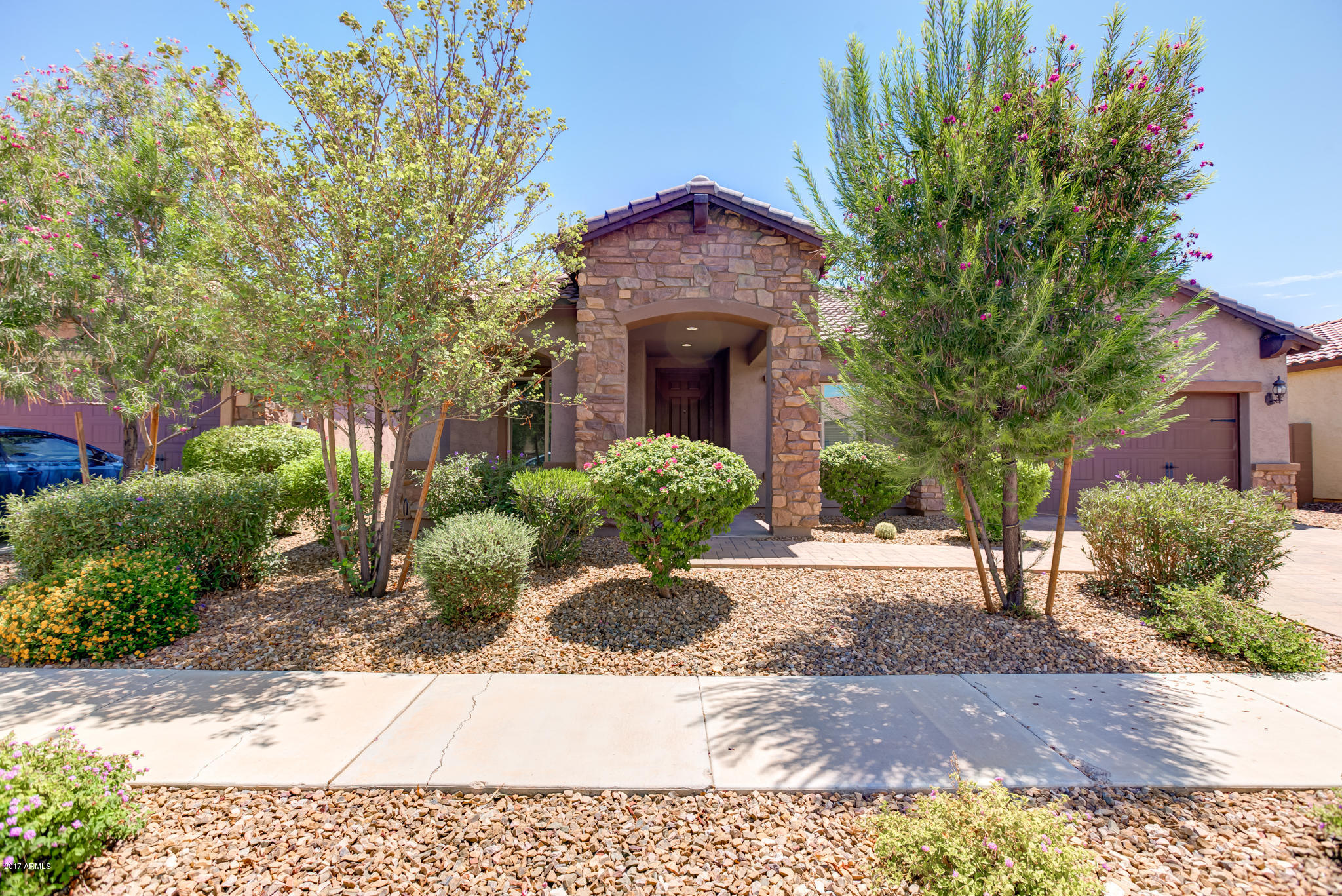 3515 East Ivanhoe Street Gilbert, AZ 85295 - Photo 2 of 49 a front view of a house with a yard and garage