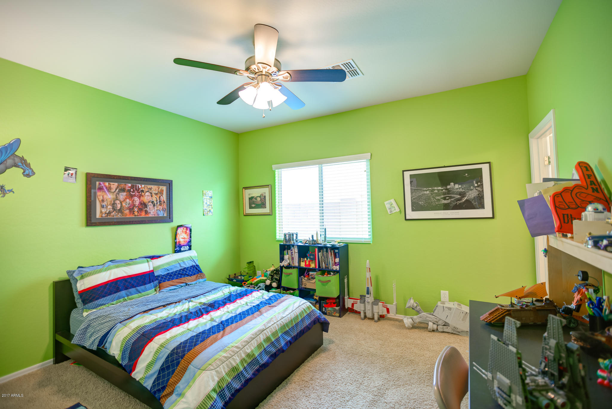 3515 East Ivanhoe Street Gilbert, AZ 85295 - Photo 25 of 49 a bedroom with a bed and a chandelier