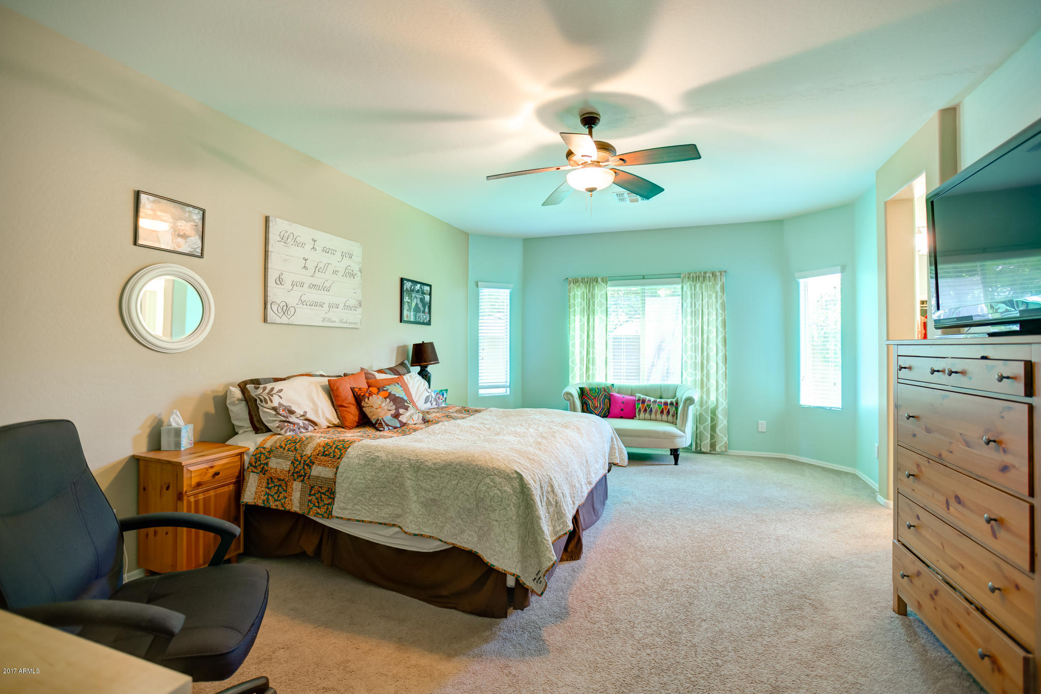 3515 East Ivanhoe Street Gilbert, AZ 85295 - Photo 29 of 49 a bedroom with a bed and a chandelier