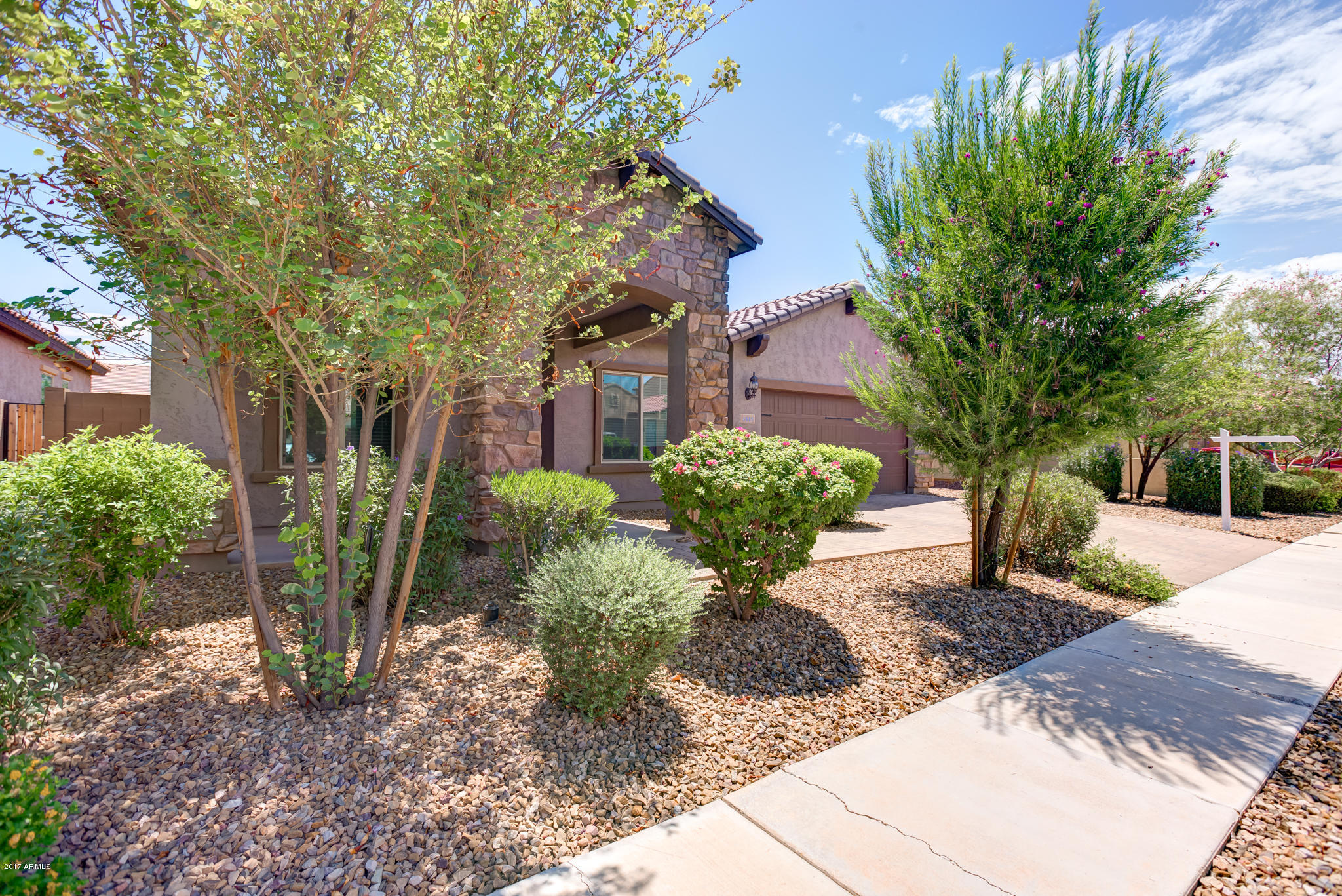 3515 East Ivanhoe Street Gilbert, AZ 85295 - Photo 3 of 49 a front view of a house with garden