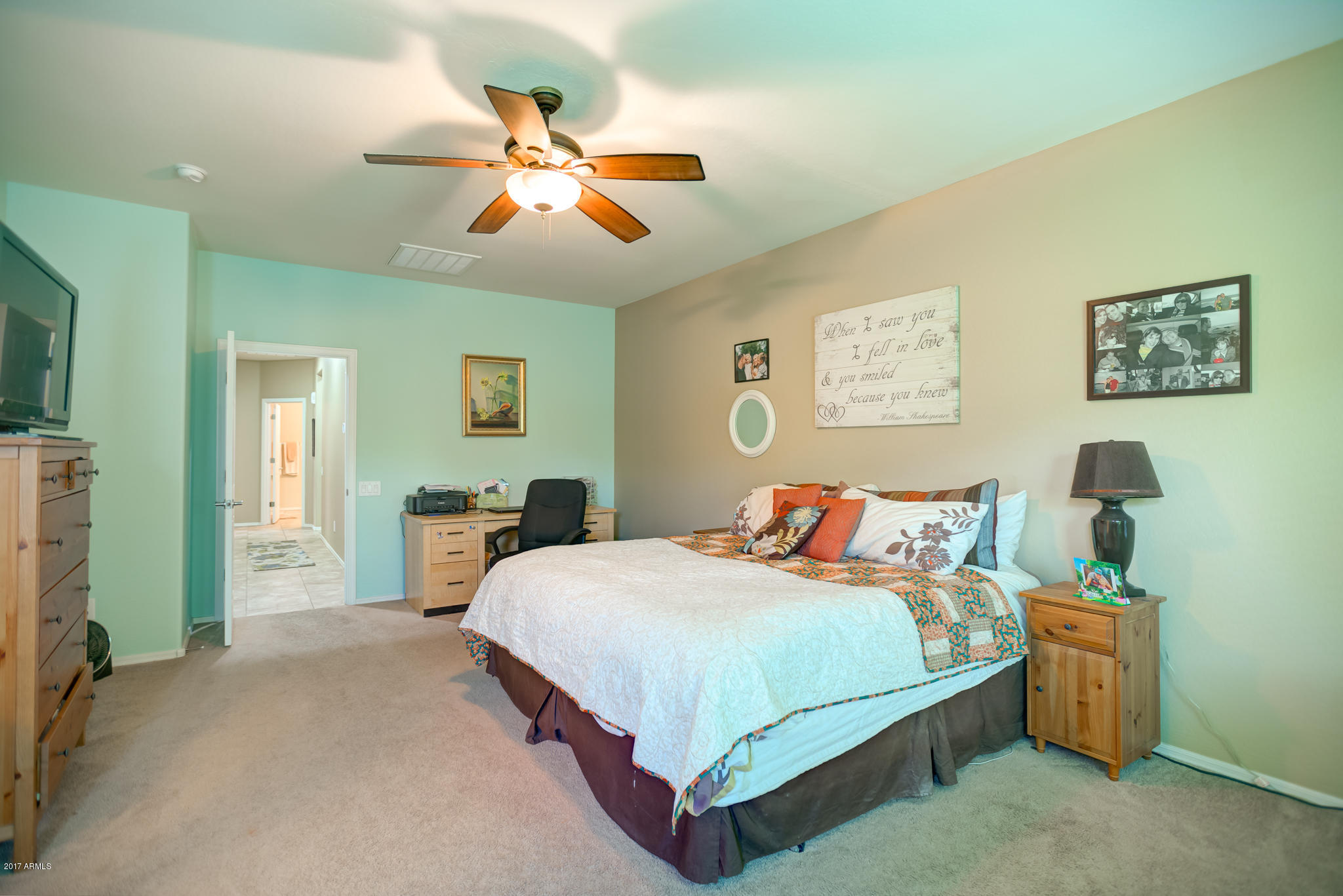 3515 East Ivanhoe Street Gilbert, AZ 85295 - Photo 31 of 49 a bedroom with a bed and a chandelier