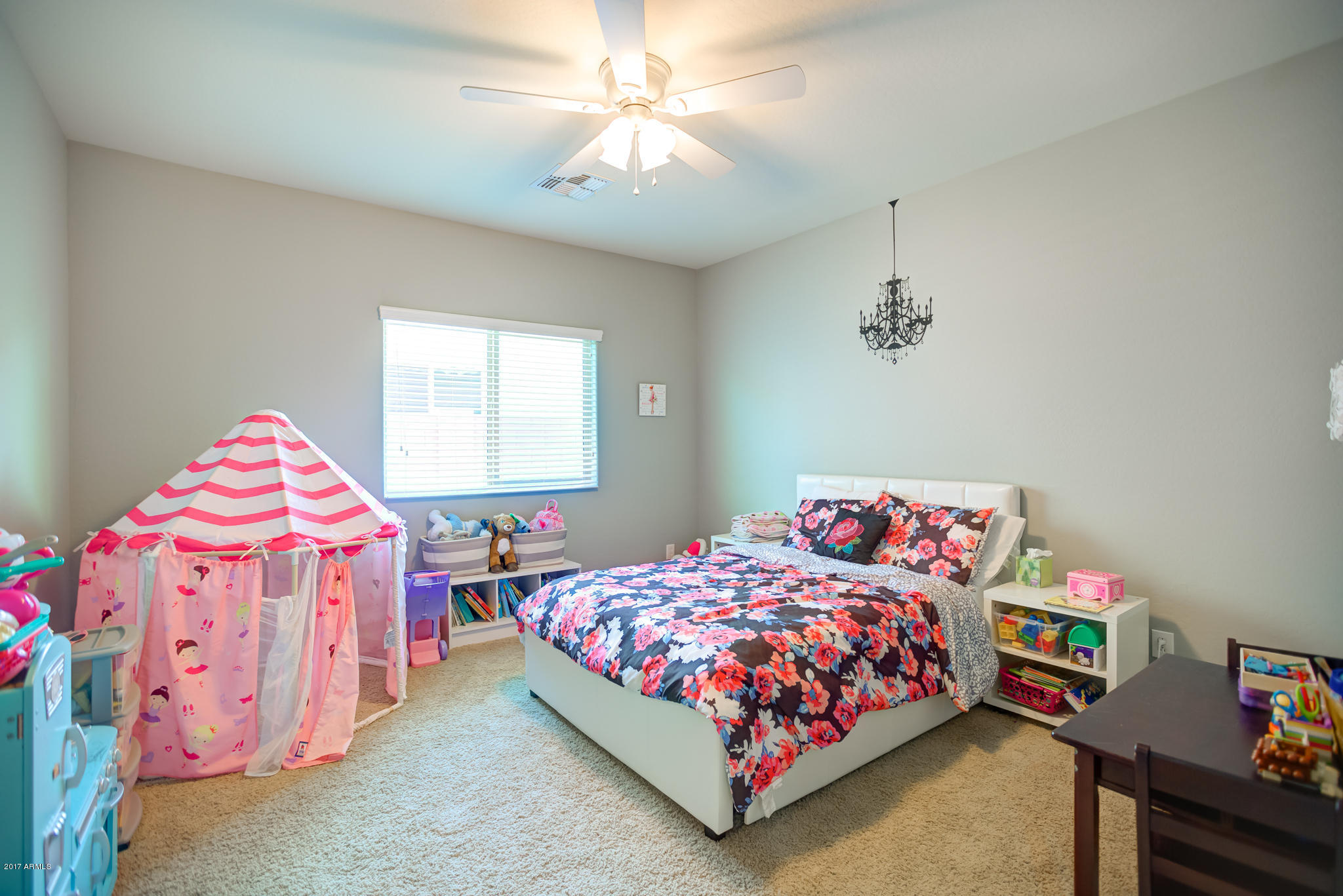 3515 East Ivanhoe Street Gilbert, AZ 85295 - Photo 36 of 49 a bedroom with a bed and a chandelier