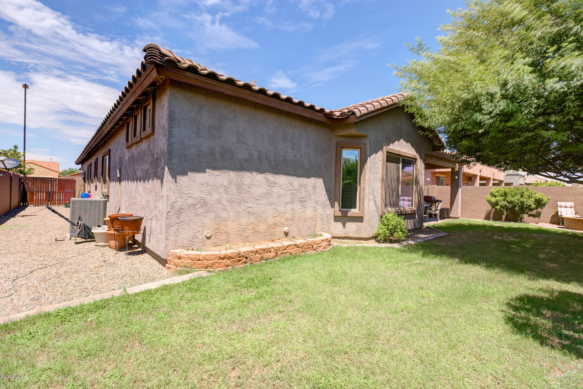 3515 East Ivanhoe Street Gilbert, AZ 85295 - Photo 43 of 49 a front view of a house with a garden and yard