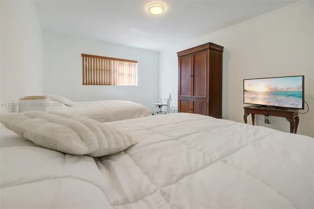 a bathroom with a granite countertop toilet sink and mirror
