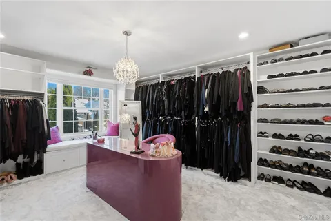 a living room with lots of furniture and a flat screen tv