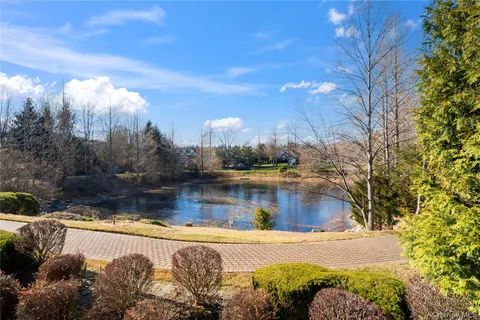 a view of a lake with a yard