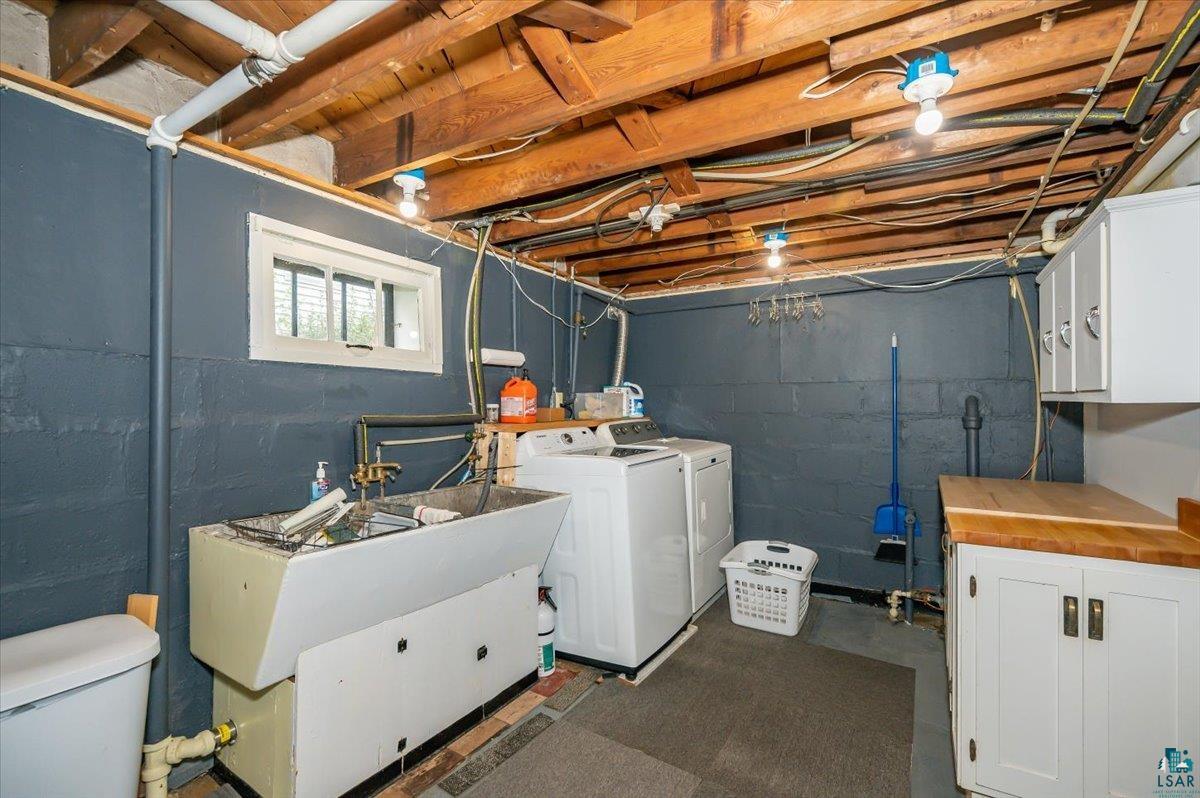 5401 Otsego Street Duluth, MN 55804 - Photo 22 of 36 Utility space featuring exposed wood joists and block walls