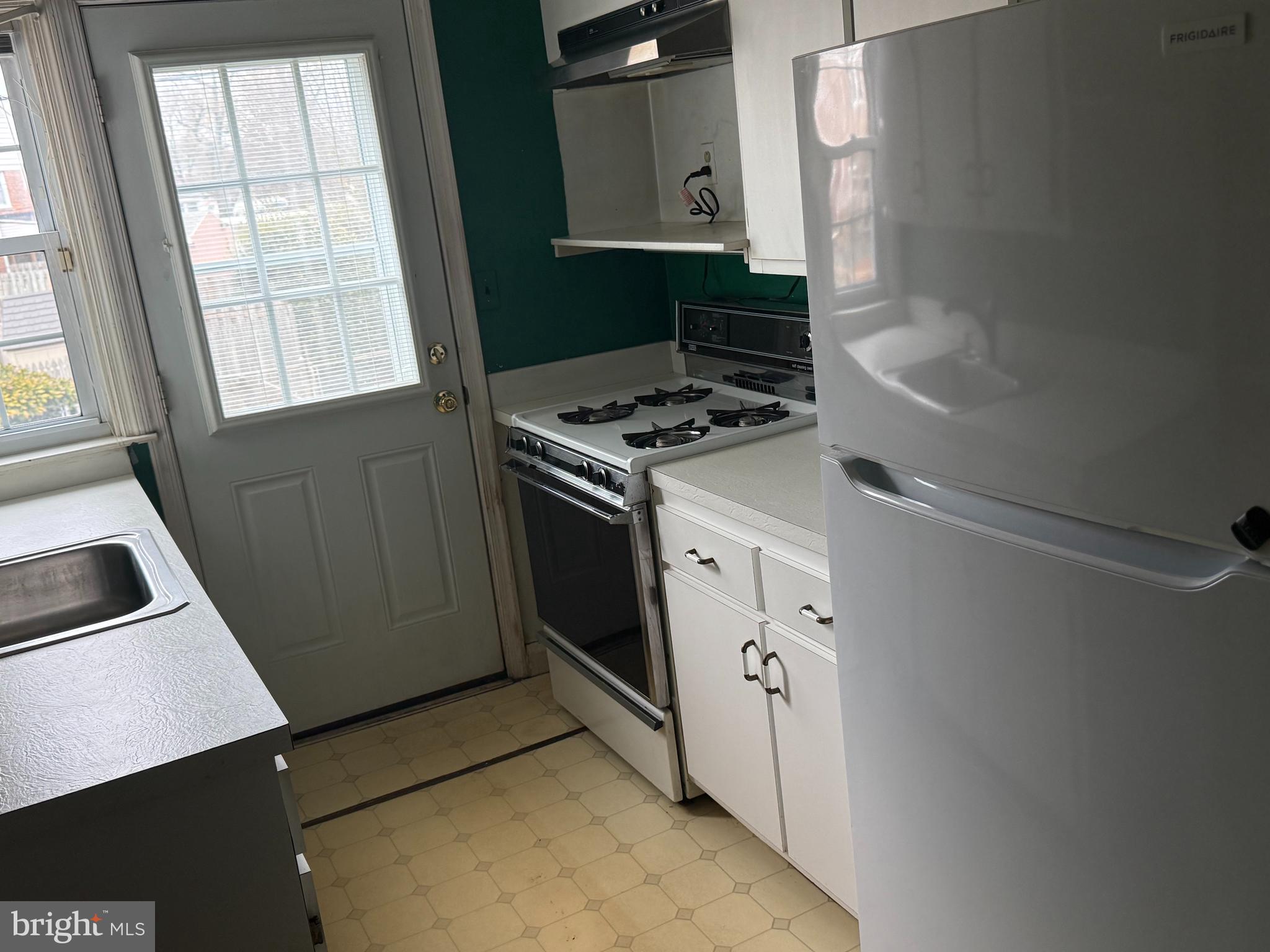 1929 Edgewood Road Towson, MD 21286 - Photo 2 of 10 a kitchen with white cabinets and white appliances