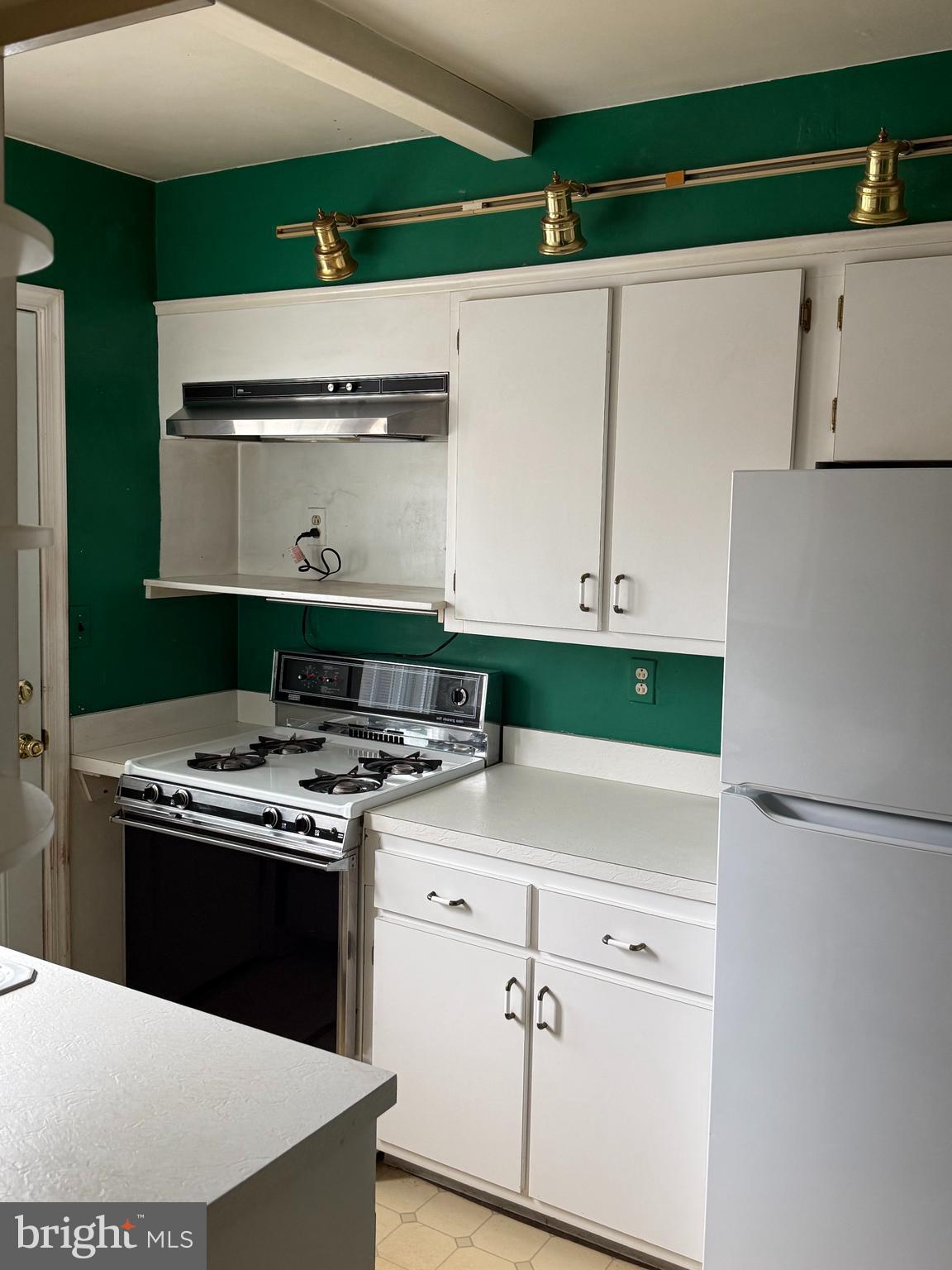 1929 Edgewood Road Towson, MD 21286 - Photo 3 of 10 a white stove top oven sitting inside of a kitchen