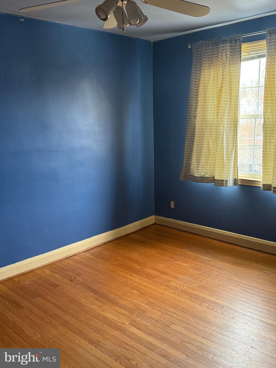 1929 Edgewood Road Towson, MD 21286 - Photo 5 of 10 a view of empty room with wooden floor and fan