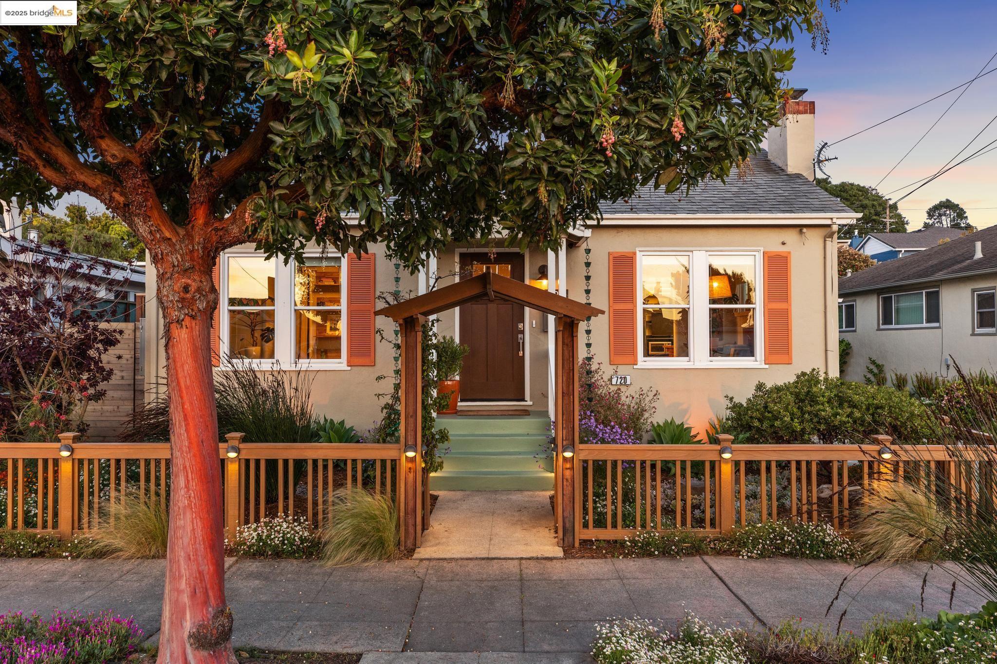 720 35th Street Richmond, CA 94805 - Photo 1 of 1 a front view of a house with a garden
