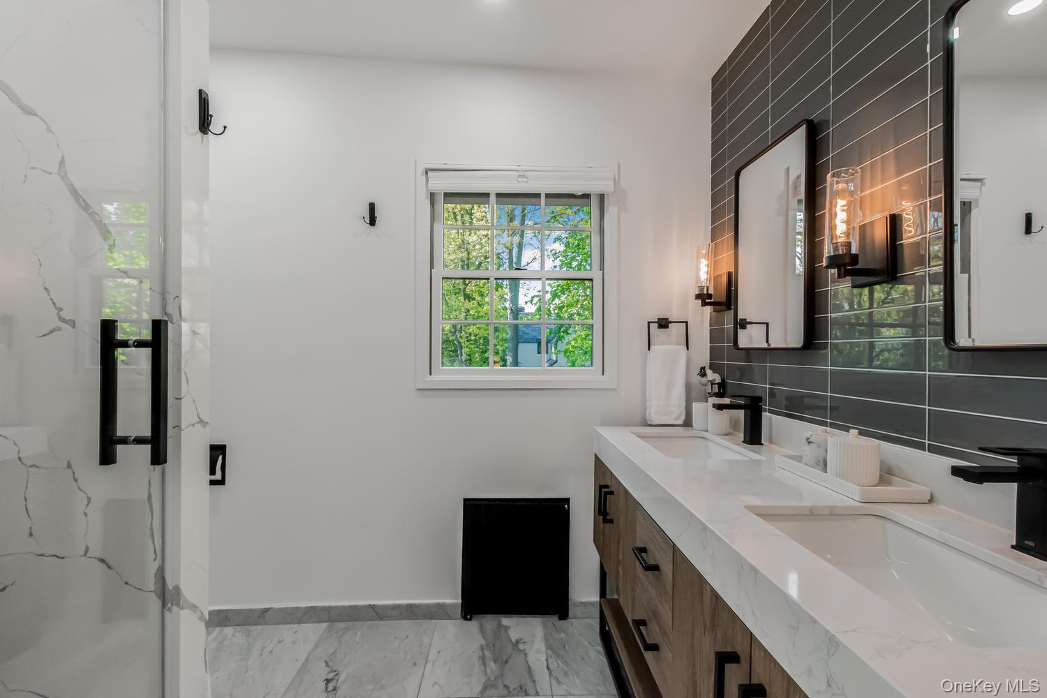 209 Storer Avenue New Rochelle, NY 10801 - Photo 16 of 39 a bathroom with a sink and a mirror