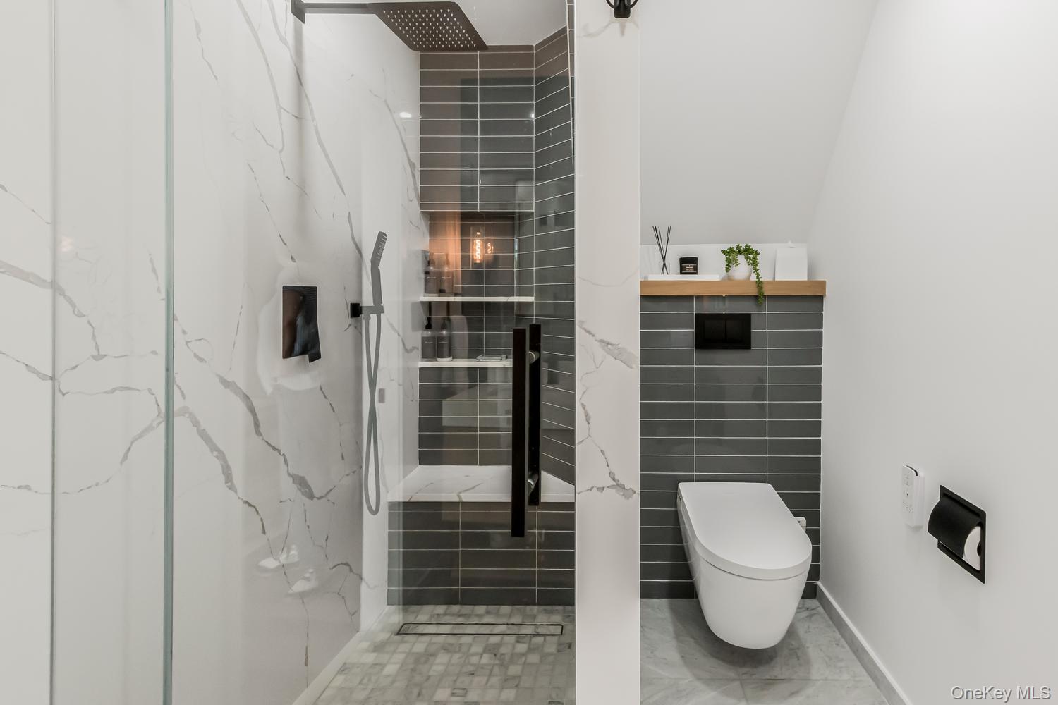 209 Storer Avenue New Rochelle, NY 10801 - Photo 17 of 39 a bathroom with a toilet and shower