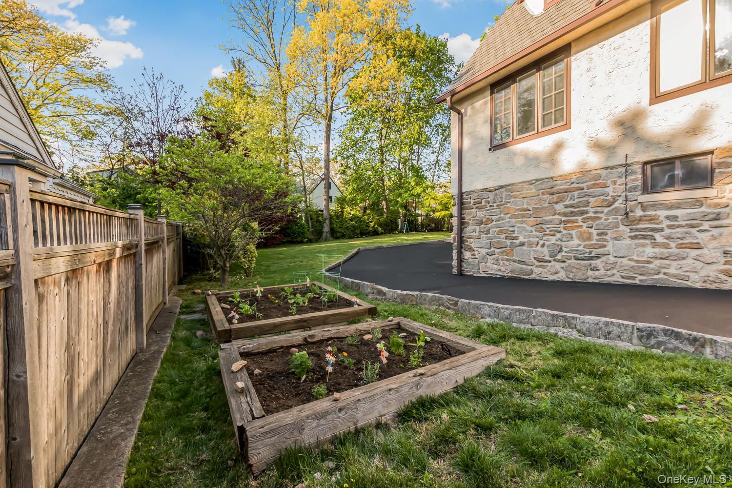209 Storer Avenue New Rochelle, NY 10801 - Photo 24 of 39 a view of a garden with wooden deck