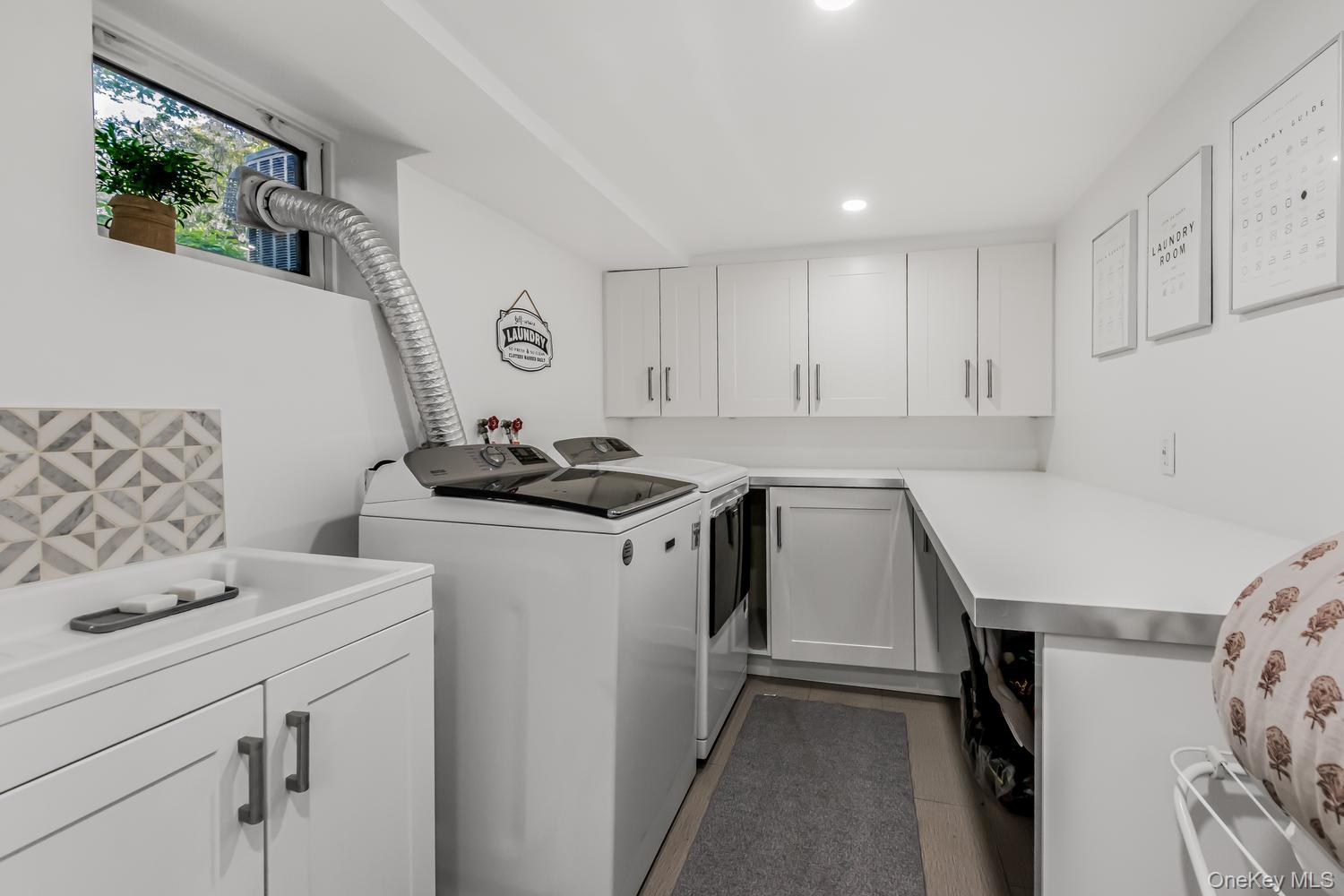 209 Storer Avenue New Rochelle, NY 10801 - Photo 29 of 39 a kitchen with a sink a stove and cabinets