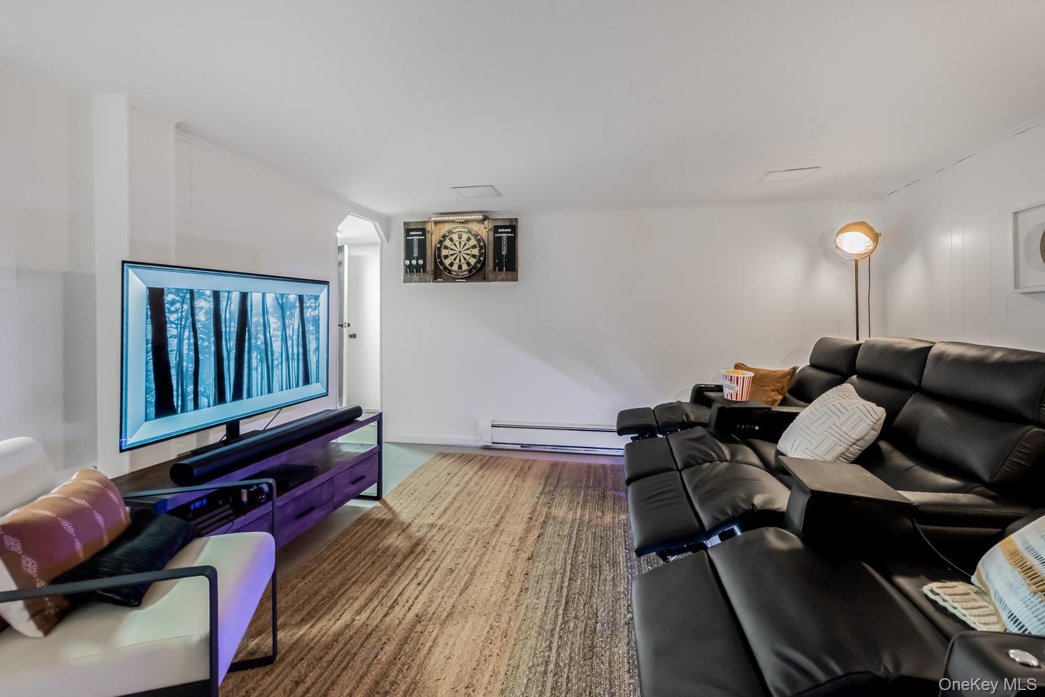 209 Storer Avenue New Rochelle, NY 10801 - Photo 31 of 39 a living room with furniture and wooden floor