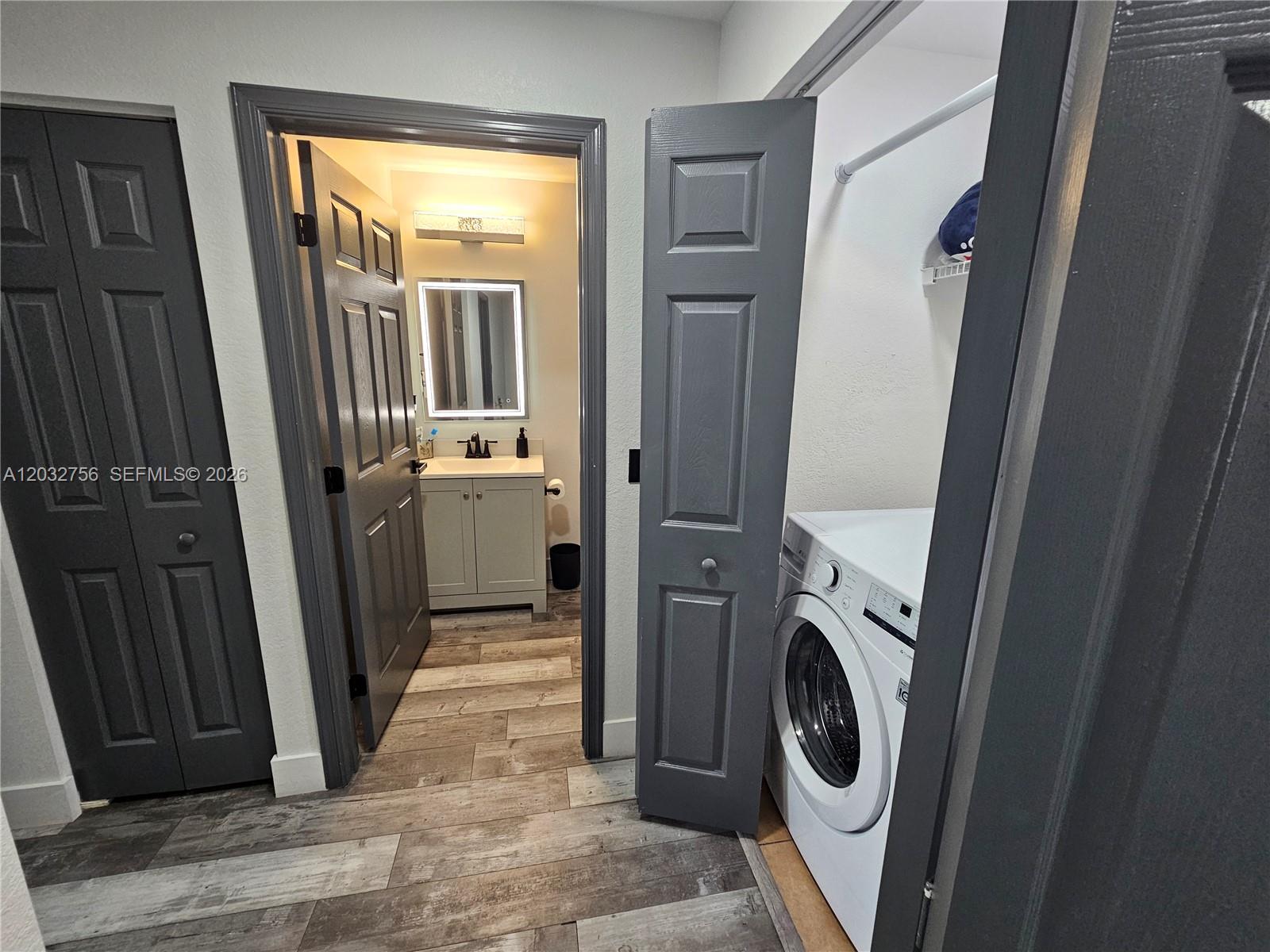 4331 Southwest 124th Way Miramar, FL 33027 - Photo 22 of 40 a view of a storage and utility room with washer and dryer