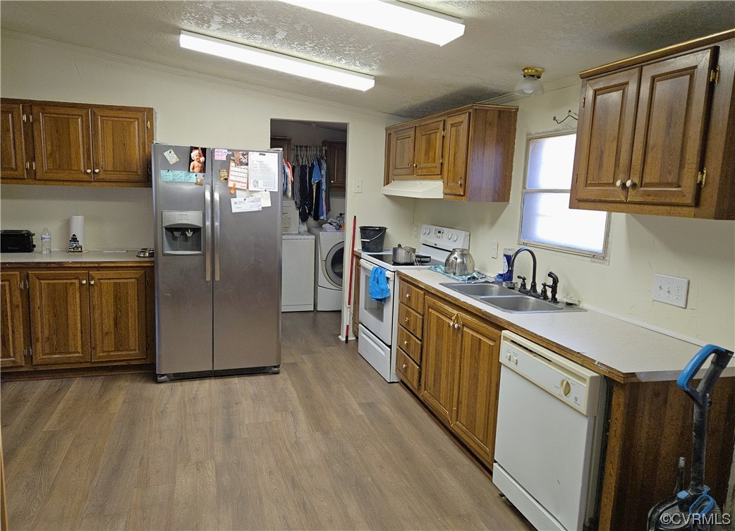 4112 Germantown Road Keysville, VA 23947 - Photo 6 of 17 a kitchen with stainless steel appliances granite countertop a refrigerator a sink dishwasher and wooden cabinets with wooden floor