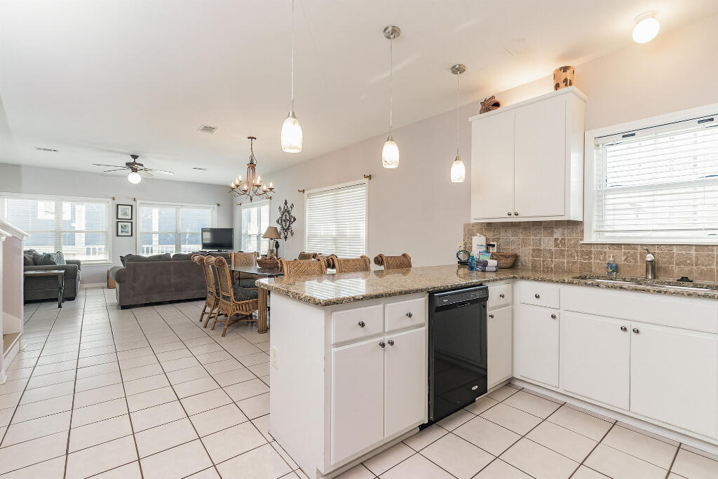 159 Gulfside Way Miramar Beach, FL 32550 - Photo 8 of 17 a kitchen with a sink window and cabinets