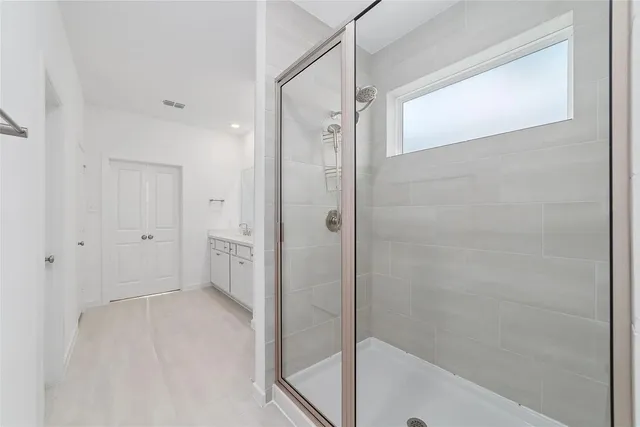 a bathroom with a bathtub and a shower