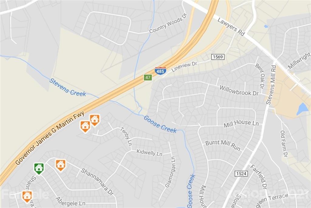 14404 Lawyers Road Matthews, NC 28104 - Photo 2 of 5 a close up of a white wall with an white umbrella