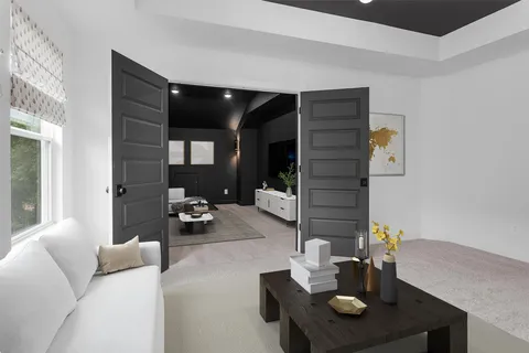 a living room with furniture and a chandelier
