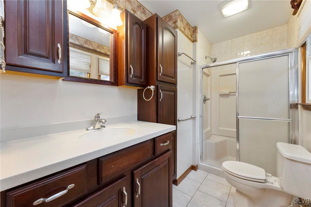 7058 Limerick Square Bethlehem, PA 18017 - Photo 17 of 30 a bathroom with a sink a toilet and shower
