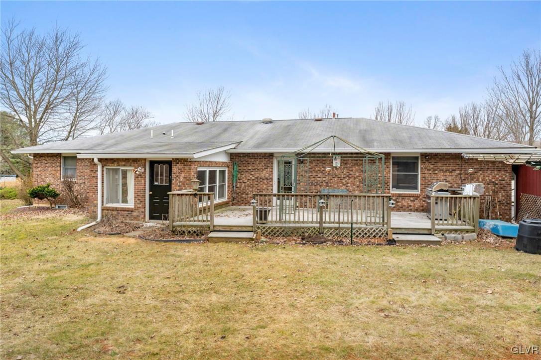 7058 Limerick Square Bethlehem, PA 18017 - Photo 29 of 30 a front view of a house with a garden and plants