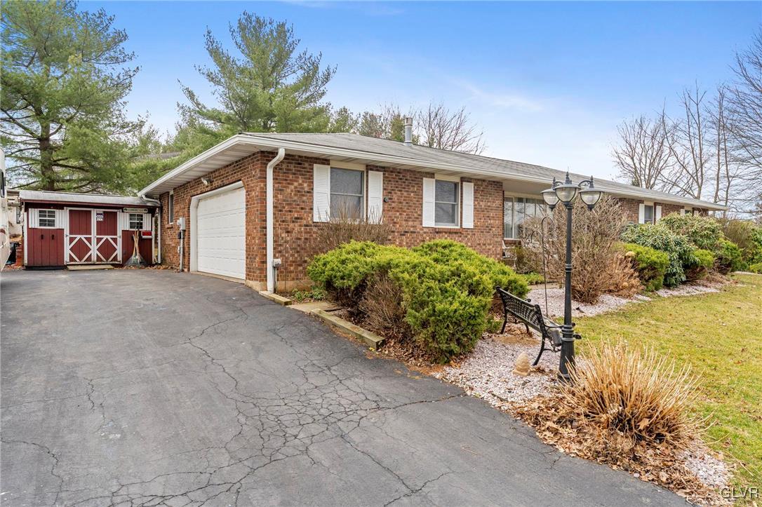 7058 Limerick Square Bethlehem, PA 18017 - Photo 3 of 30 a front view of a house with garden