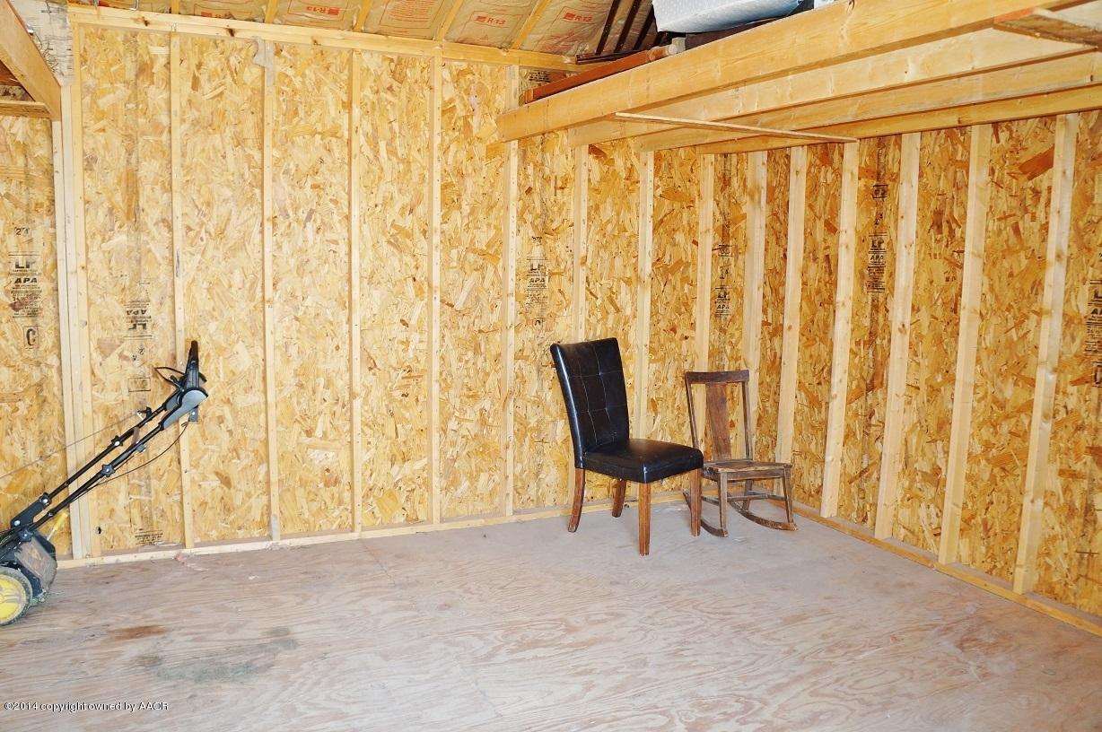 4910 Capulin Lane Amarillo, TX 79110 - Photo 17 of 17 a view of wooden floor and chair