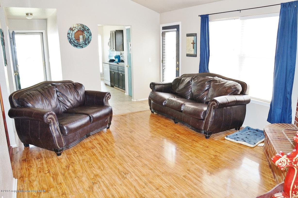 4910 Capulin Lane Amarillo, TX 79110 - Photo 4 of 17 a living room with couches and a rug