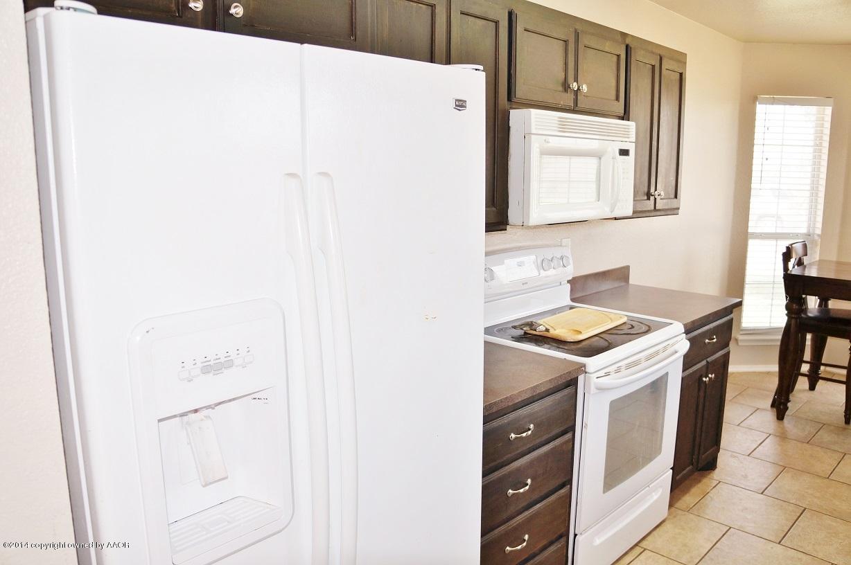 4910 Capulin Lane Amarillo, TX 79110 - Photo 6 of 17 a utility room with dryer and washer
