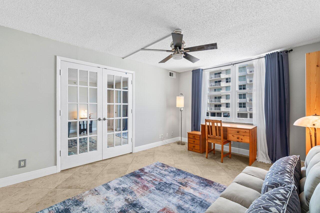 4511 South Ocean Boulevard, Unit 106 Highland Beach, FL 33487 - Photo 12 of 37 a living room with furniture and a window
