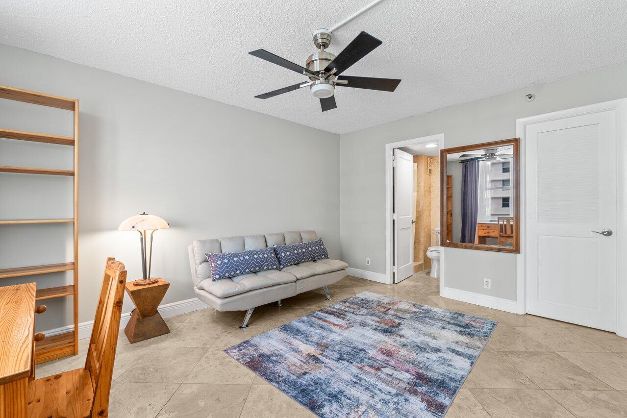 4511 South Ocean Boulevard, Unit 106 Highland Beach, FL 33487 - Photo 13 of 37 a living room with furniture and a rug