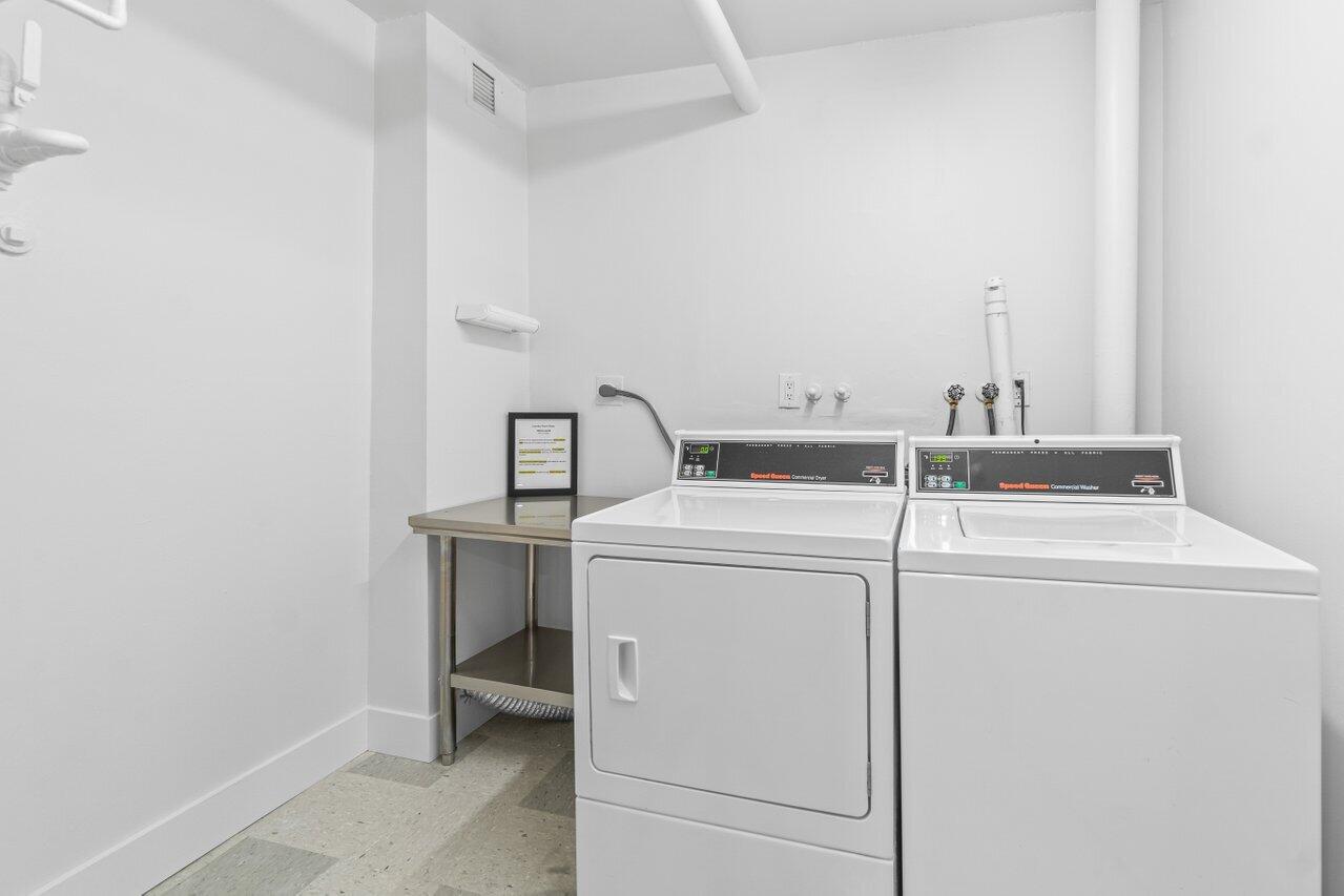 4511 South Ocean Boulevard, Unit 106 Highland Beach, FL 33487 - Photo 22 of 37 a utility room with dryer and washer