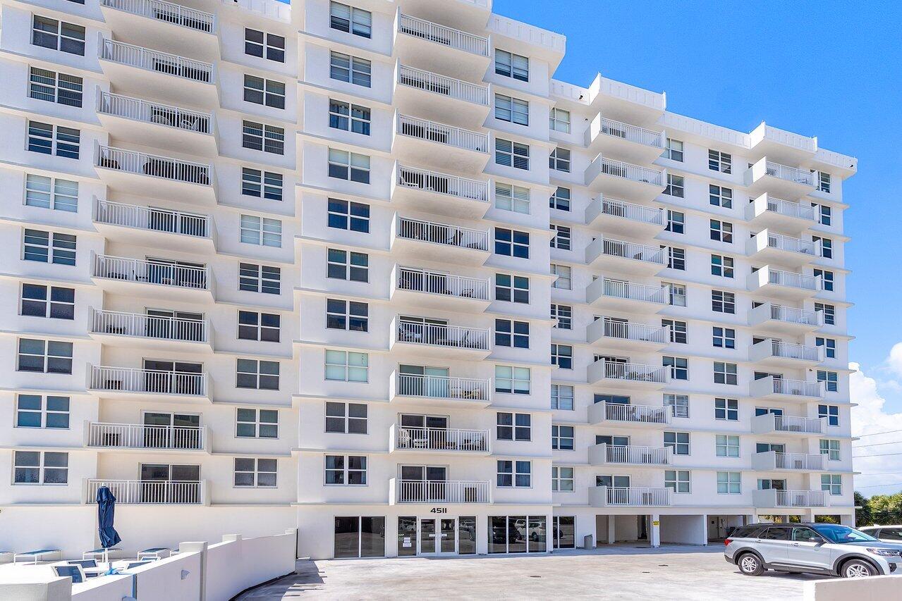 4511 South Ocean Boulevard, Unit 106 Highland Beach, FL 33487 - Photo 23 of 37 a view of a building with a street