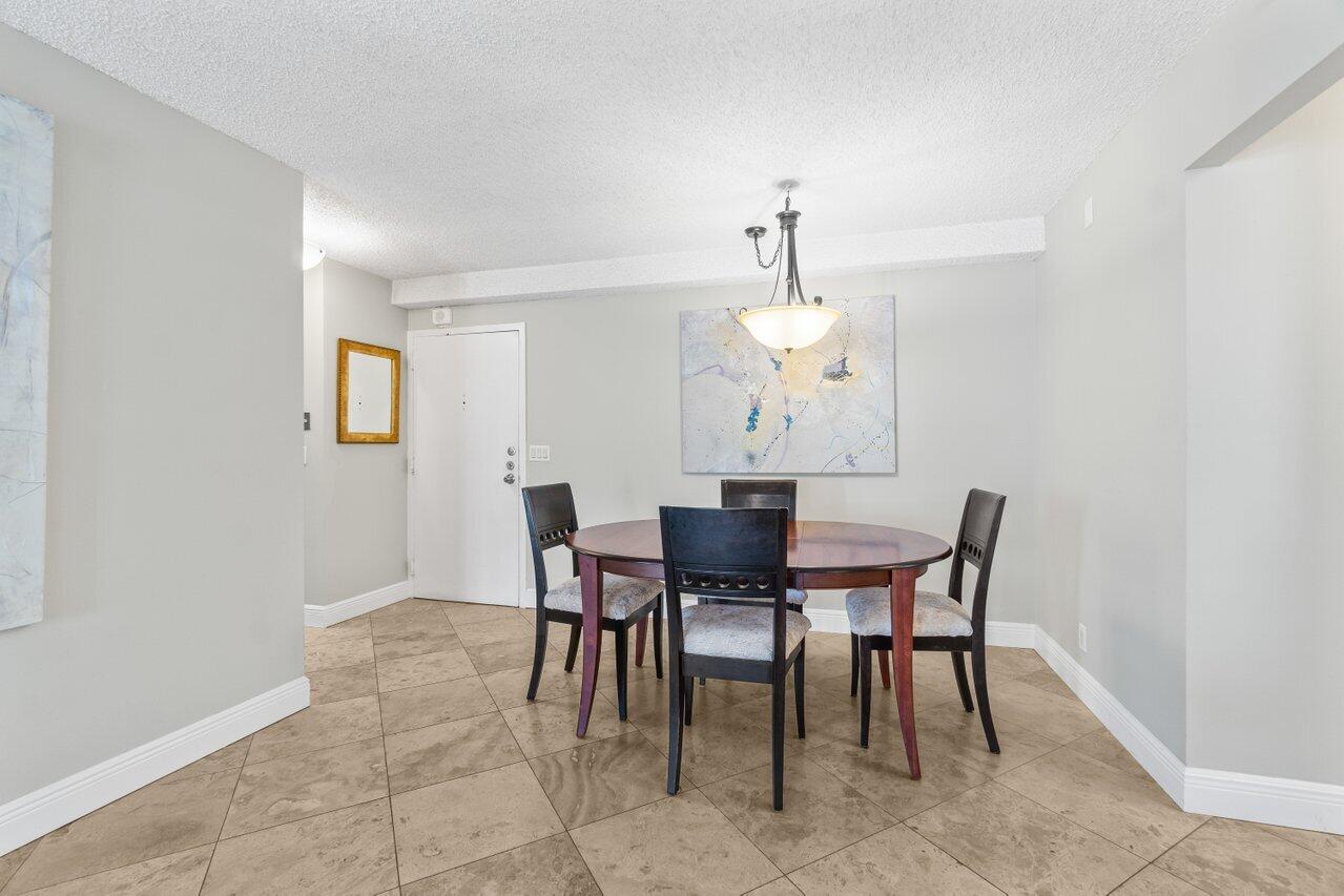 4511 South Ocean Boulevard, Unit 106 Highland Beach, FL 33487 - Photo 6 of 37 a view of a dining room with furniture