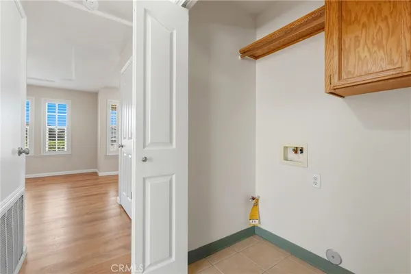 a view of an entryway with wooden floor