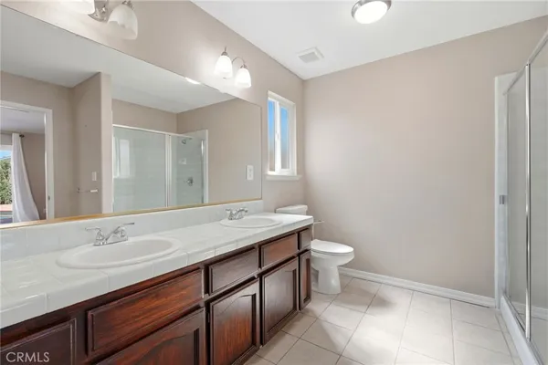 a bathroom with a sink vanity and a mirror