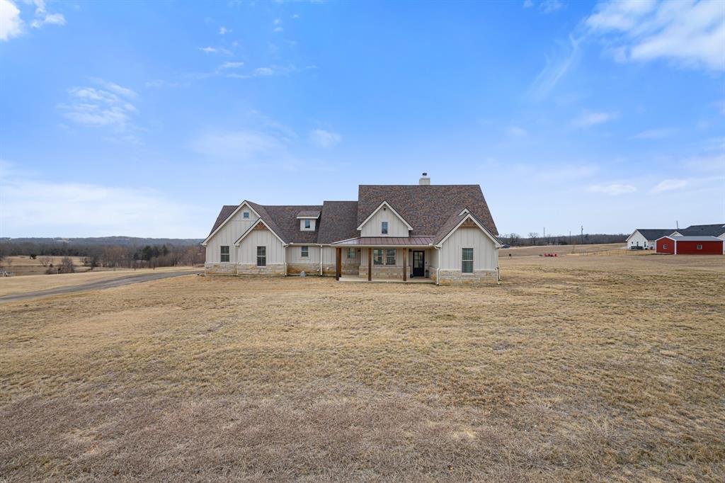 476 Silverleaf Drive Sunset, TX 76270 - Photo 39 of 40 a front view of a house with a big yard