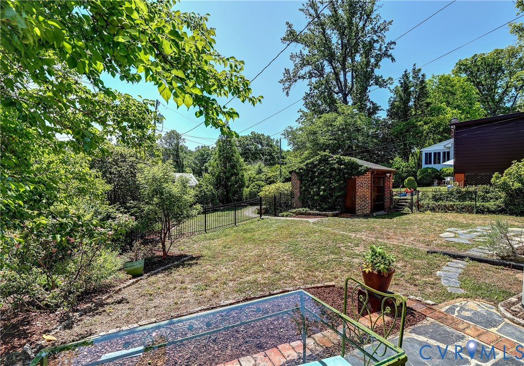 4814 Riverside Drive Richmond, VA 23225 - Photo 34 of 39 a yard with some trees in the background